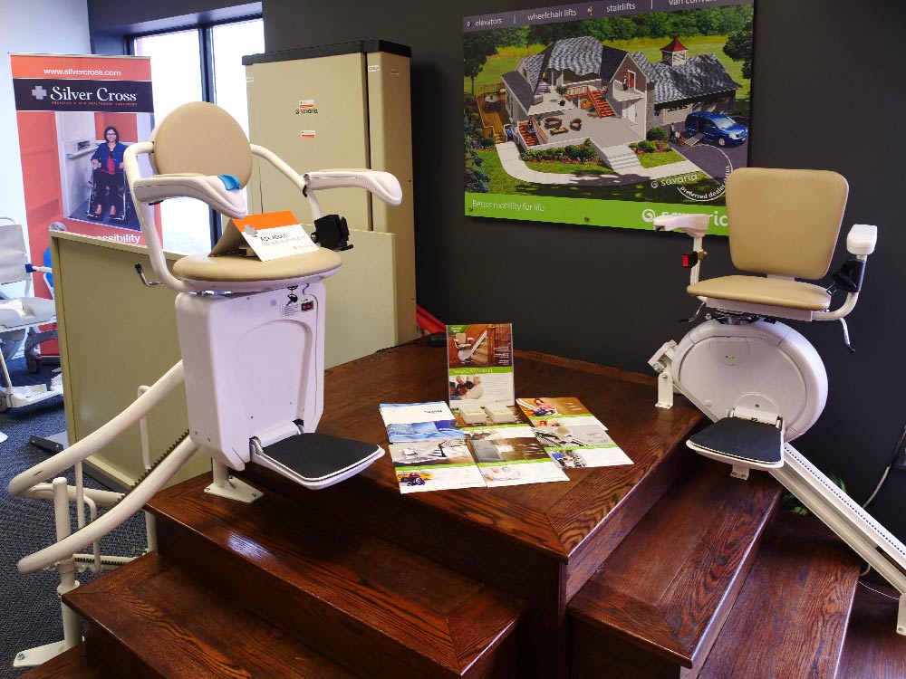 Savaria straight and curved stairlift in Silver Cross showroom